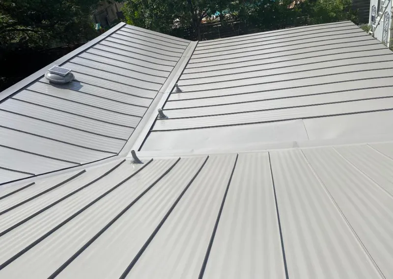Solar attic fan installed on a metal roof for Roof Ventilation in South Orange Village